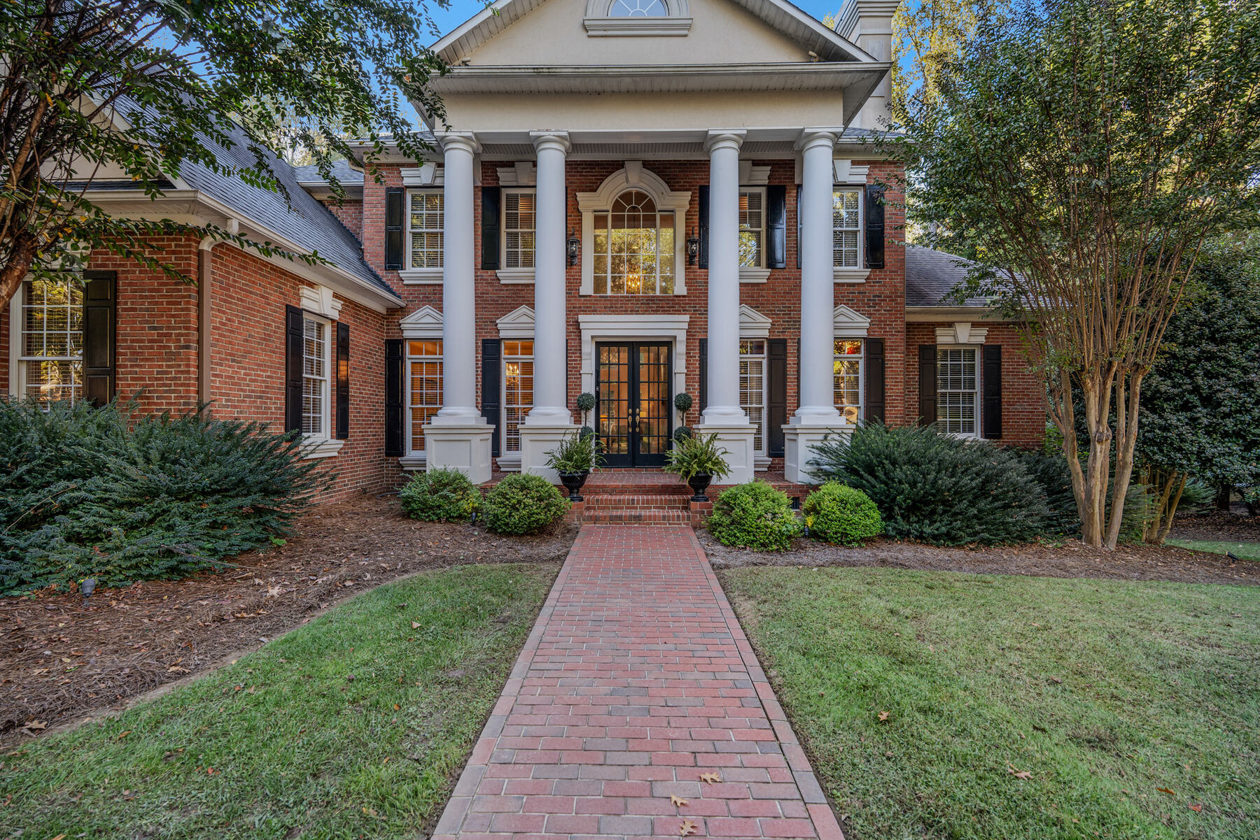 The brick walk to the colonnade and portico